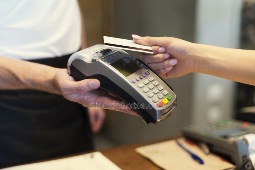 close up customer paying by credit card