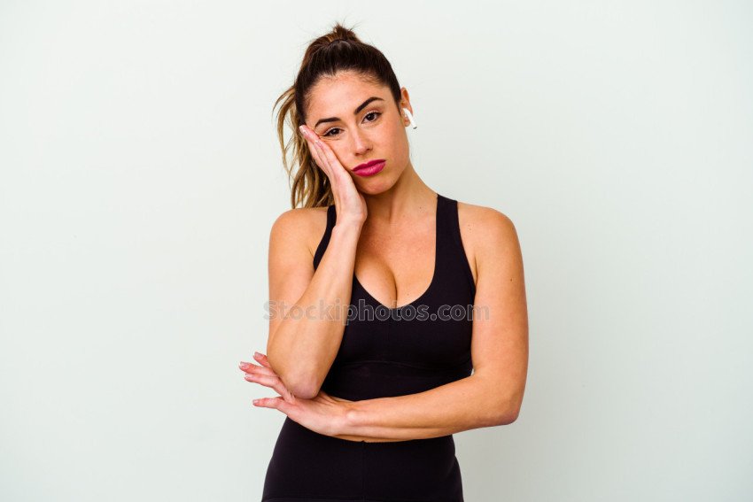 Young sport caucasian woman isolated on white background